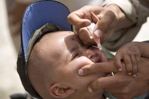 A medical worker vaccinates a boy against polio. More than five million children were vaccinated in two rounds of sub National Immunization Days (NIDs) in June this year