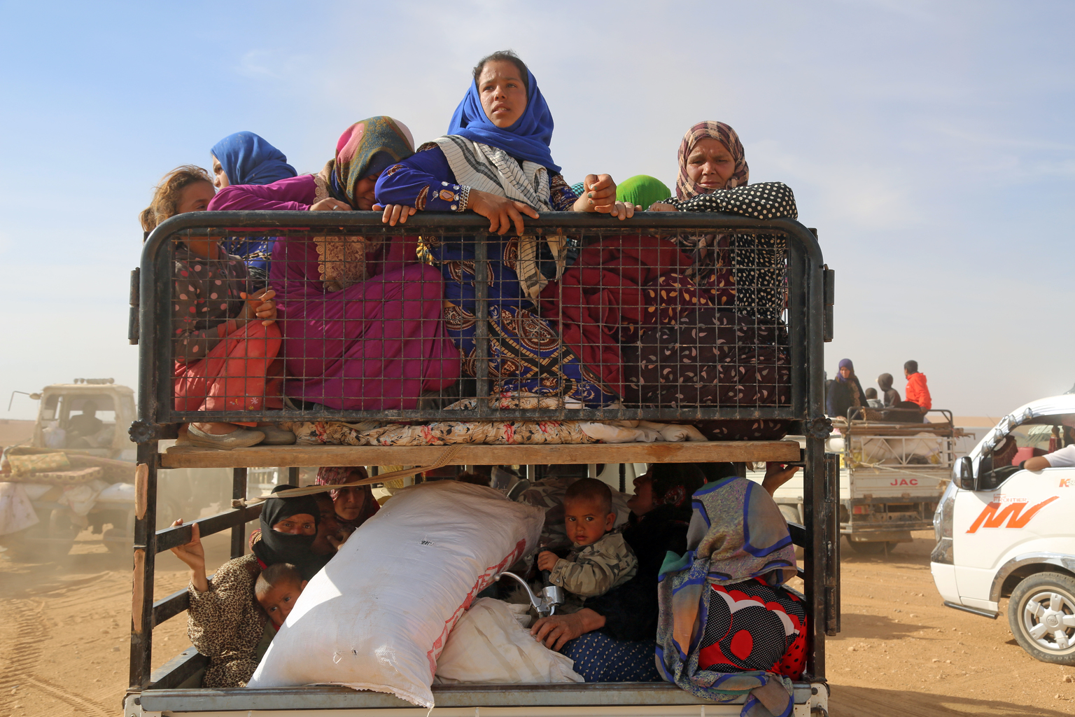 Displaced children and adults are seen in a vehicle after fleeing from ISIL- controlled areas in rural Raqqa in Syria. Photo Credit: UNICEF