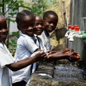 Children washing their hands at their school